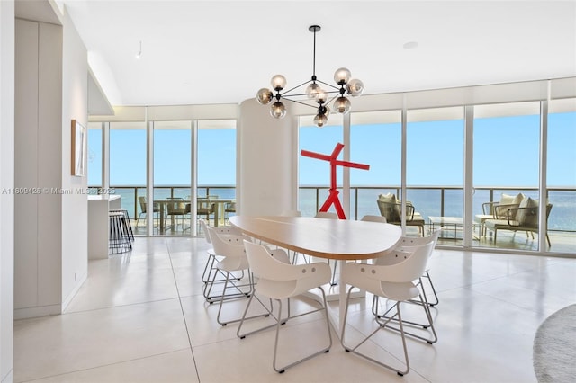 9703 Collins Ave Unit 1700, Bal Harbour, FL 33154 - dining area featuring a chandelier, a wall of windows, and a water view