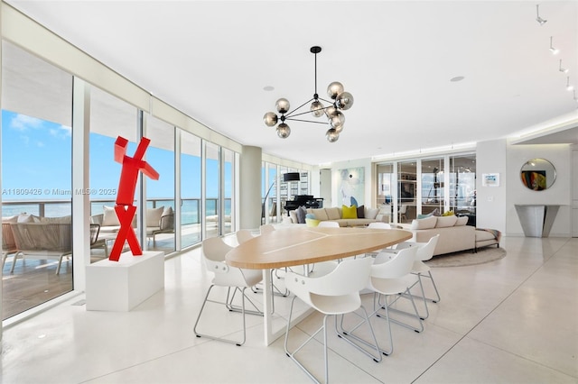 9703 Collins Ave Unit 1700, Bal Harbour, FL 33154 - dining space featuring floor to ceiling windows and a chandelier