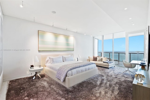 9703 Collins Ave Unit 1700, Bal Harbour, FL 33154 - bedroom featuring expansive windows, carpet, and a water view