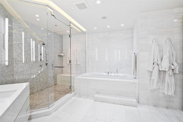 9703 Collins Ave Unit 1700, Bal Harbour, FL 33154 - bathroom with a garden tub, a stall shower, vanity, recessed lighting, and tile walls