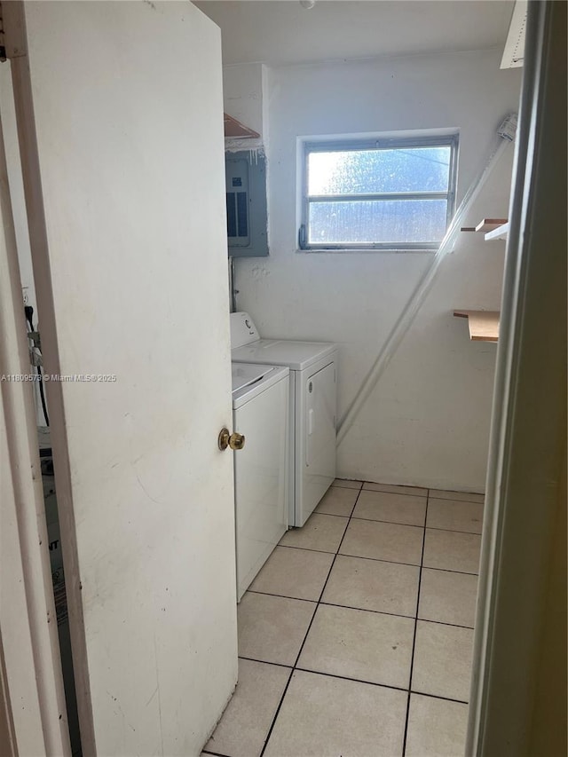 6301 Moseley St, Hollywood, FL 33024 - washroom with washer and dryer, electric panel, and light tile patterned floors
