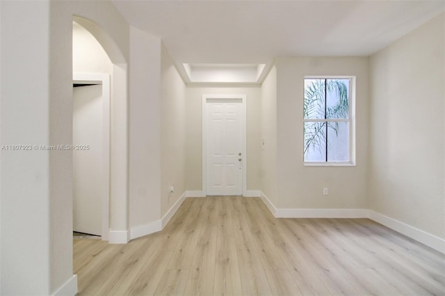 8144 NW 107th Path, Doral, FL 33178 - foyer entrance featuring light wood-style floors, baseboards, and arched walkways