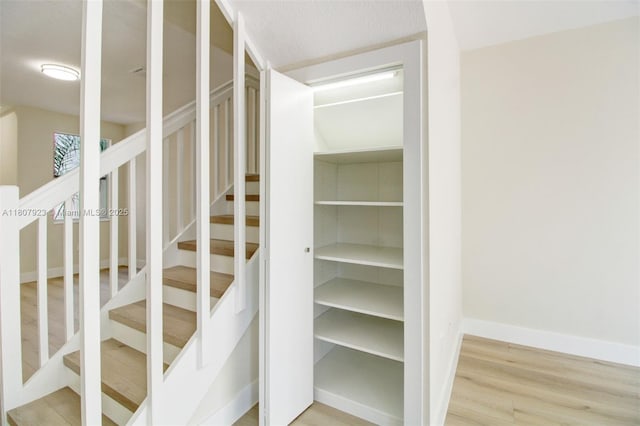8144 NW 107th Path, Doral, FL 33178 - stairway with wood finished floors and baseboards