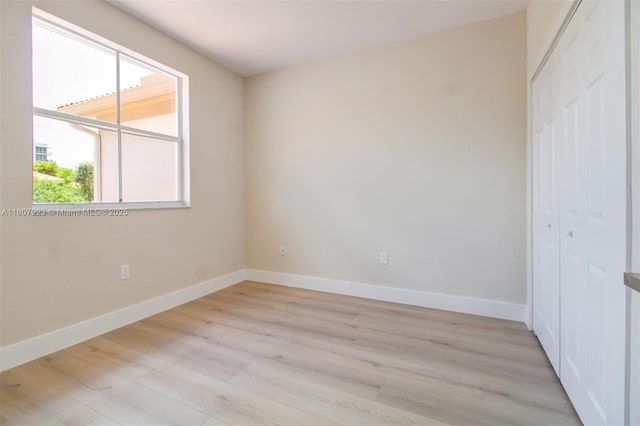 8144 NW 107th Path, Doral, FL 33178 - unfurnished room featuring light wood-style flooring and baseboards