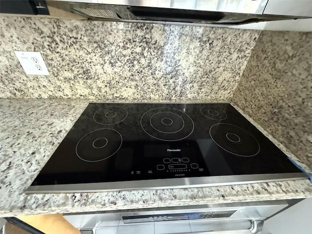 4168 Inverrary Dr Unit 111, Lauderhill, FL 33319 - kitchen view of exhaust hood and black electric cooktop