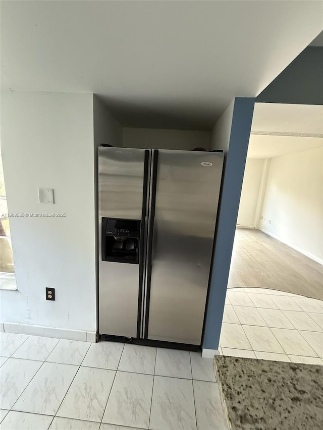 4168 Inverrary Dr Unit 111, Lauderhill, FL 33319 - kitchen featuring stainless steel fridge and light marble finish floors