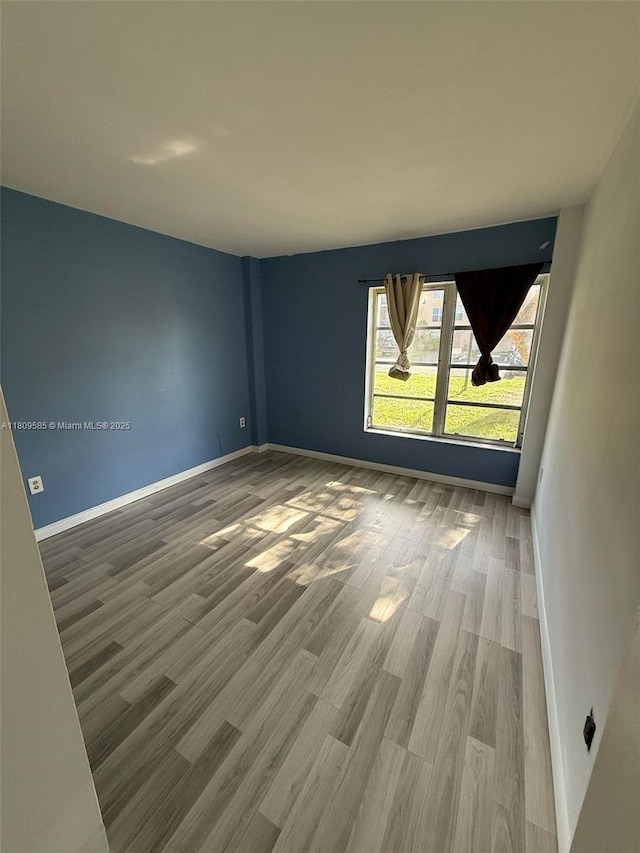 4168 Inverrary Dr Unit 111, Lauderhill, FL 33319 - spare room with wood finished floors