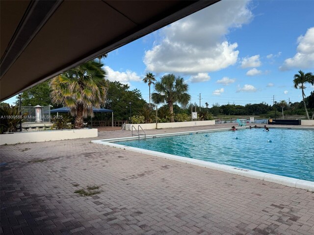 4168 Inverrary Dr Unit 111, Lauderhill, FL 33319 - community pool with a patio