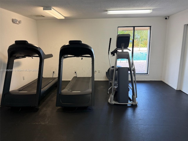 4168 Inverrary Dr Unit 111, Lauderhill, FL 33319 - gym featuring a textured ceiling and baseboards