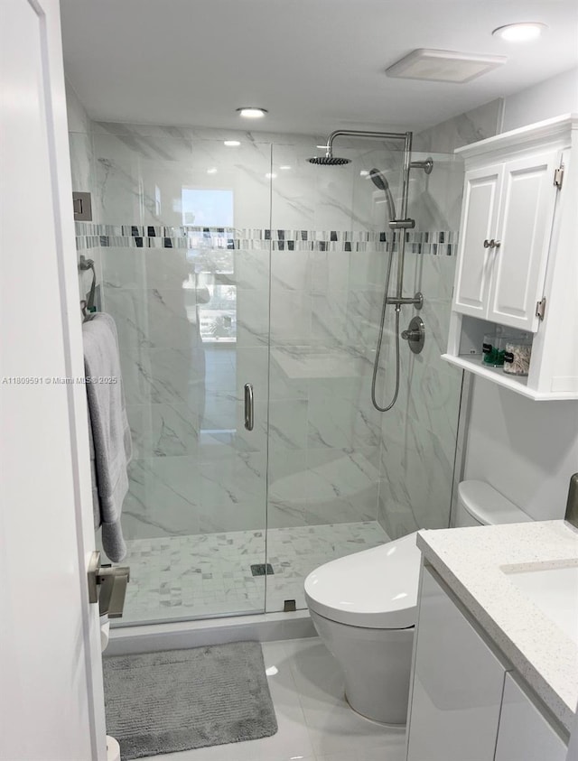 2017 S Ocean Dr Unit 1510, Hallandale Beach, FL 33009 - bathroom featuring toilet, a marble finish shower, vanity, and marble look tile flooring