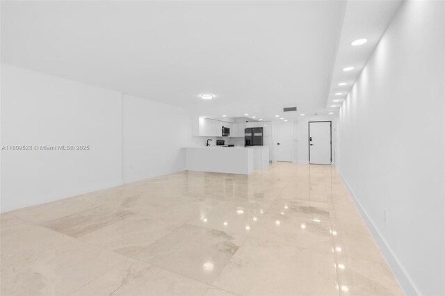 2300 Diana Dr Unit 302, Hallandale Beach, FL 33009 - unfurnished living room with recessed lighting, light marble finish floors, and baseboards