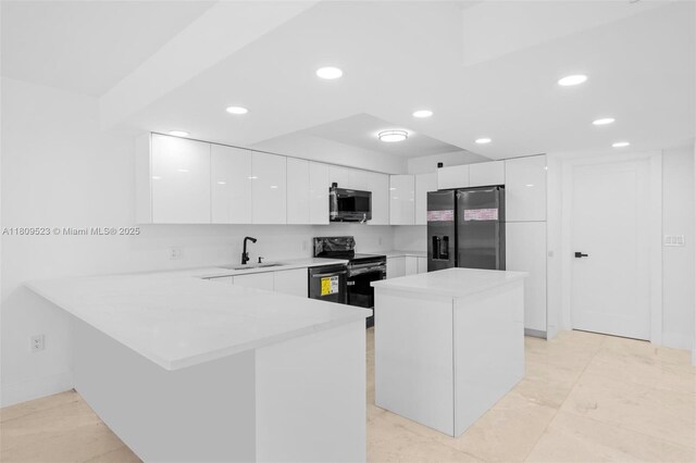 2300 Diana Dr Unit 302, Hallandale Beach, FL 33009 - kitchen featuring stainless steel fridge, electric range, modern cabinets, a sink, and recessed lighting