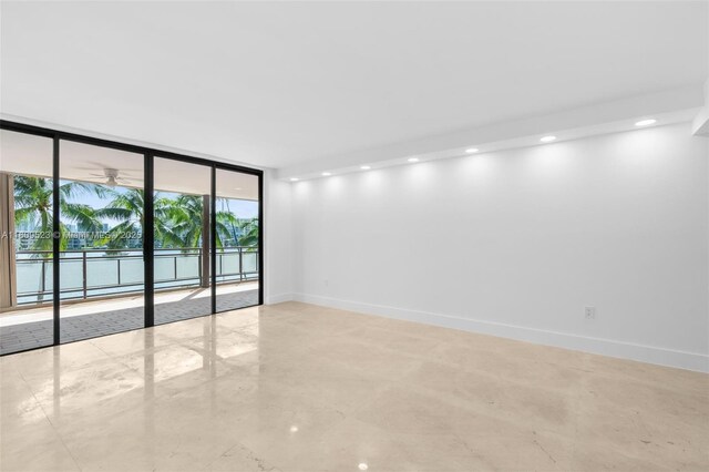 2300 Diana Dr Unit 302, Hallandale Beach, FL 33009 - spare room with floor to ceiling windows, baseboards, and recessed lighting