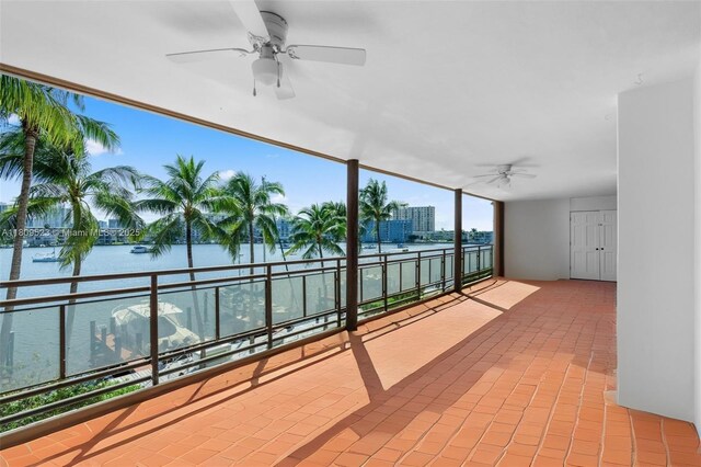 2300 Diana Dr Unit 302, Hallandale Beach, FL 33009 - view of patio featuring a ceiling fan, a balcony, and a water view