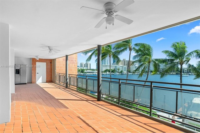 2300 Diana Dr Unit 302, Hallandale Beach, FL 33009 - view of patio / terrace with ceiling fan, a balcony, a water view, and a view of city