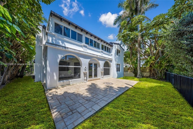 5757 Alton Rd, Miami Beach, FL 33140 - rear view of house featuring french doors, a balcony, a patio area, and stucco siding