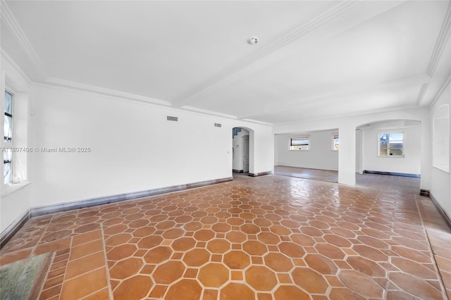 5757 Alton Rd, Miami Beach, FL 33140 - unfurnished living room with arched walkways, ornamental molding, and baseboards