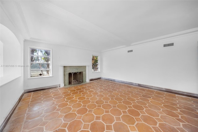 5757 Alton Rd, Miami Beach, FL 33140 - unfurnished living room with crown molding, plenty of natural light, a fireplace with flush hearth, and baseboards