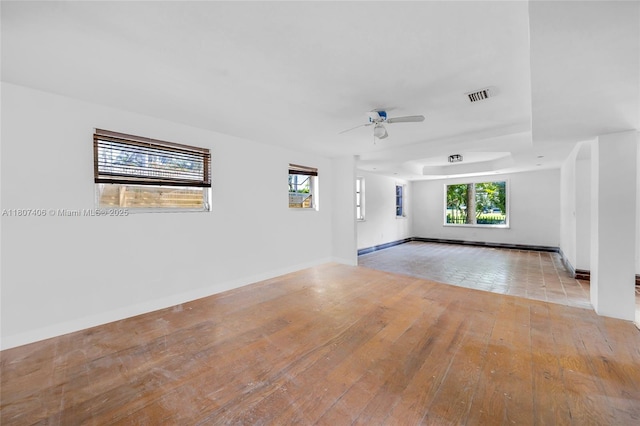5757 Alton Rd, Miami Beach, FL 33140 - unfurnished room featuring hardwood / wood-style floors, ceiling fan, and baseboards