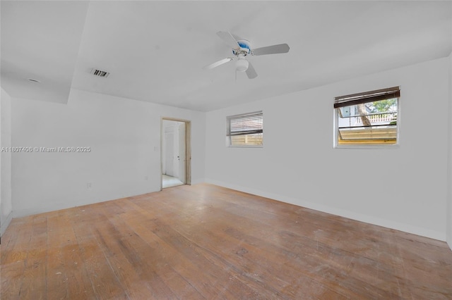 5757 Alton Rd, Miami Beach, FL 33140 - spare room with a ceiling fan, hardwood / wood-style flooring, and baseboards