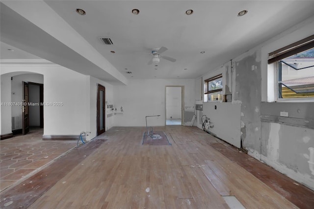5757 Alton Rd, Miami Beach, FL 33140 - unfurnished room with a ceiling fan, arched walkways, and light wood-style floors