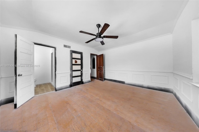 5757 Alton Rd, Miami Beach, FL 33140 - unfurnished bedroom with ornamental molding, light wood-style flooring, wainscoting, a decorative wall, and a ceiling fan