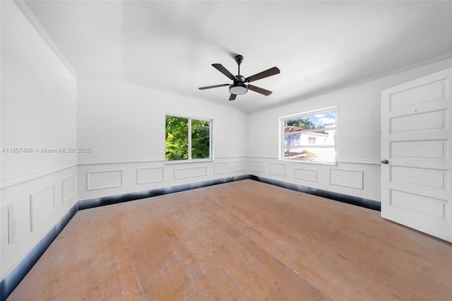 5757 Alton Rd, Miami Beach, FL 33140 - unfurnished room featuring ceiling fan, a wainscoted wall, a decorative wall, wood finished floors, and ornamental molding