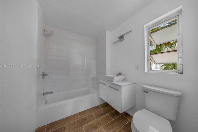 5757 Alton Rd, Miami Beach, FL 33140 - bathroom featuring toilet, shower / bath combination, vanity, and wood finish floors