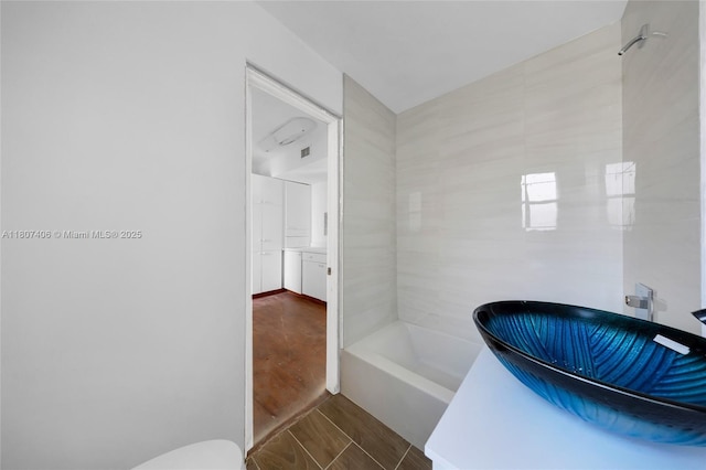 5757 Alton Rd, Miami Beach, FL 33140 - full bath featuring a sink, a tub to relax in, and toilet