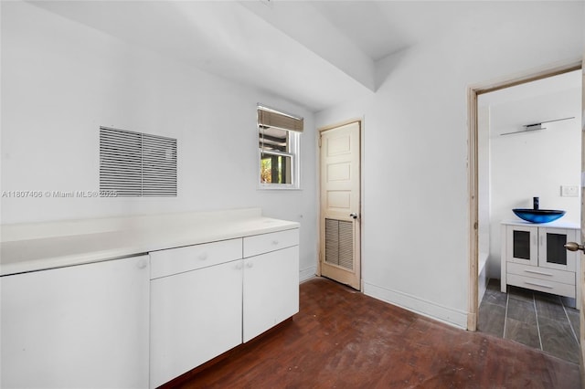 5757 Alton Rd, Miami Beach, FL 33140 - bathroom with wood finished floors, baseboards, and vanity