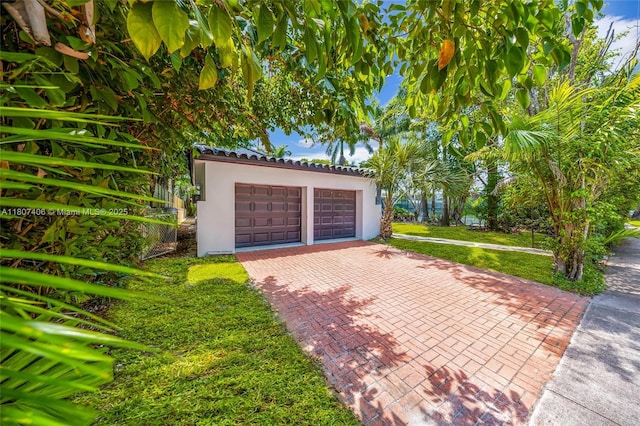 5757 Alton Rd, Miami Beach, FL 33140 - garage featuring decorative driveway
