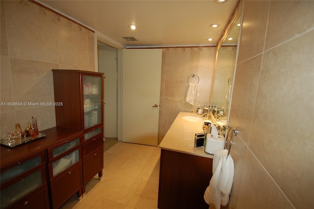 8877 Collins Ave Unit 507, Surfside, FL 33154 - bathroom featuring tile walls, vanity, and recessed lighting