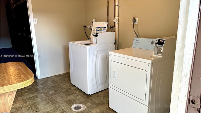 550 NW 80th Ter Unit 103, Margate, FL 33063 - laundry area featuring washing machine and clothes dryer and baseboards