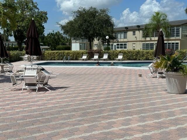 550 NW 80th Ter Unit 103, Margate, FL 33063 - community pool with a patio