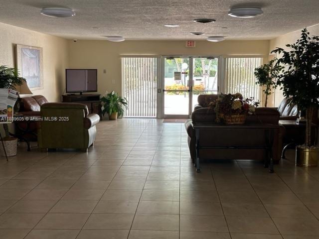 550 NW 80th Ter Unit 103, Margate, FL 33063 - lobby with a textured ceiling