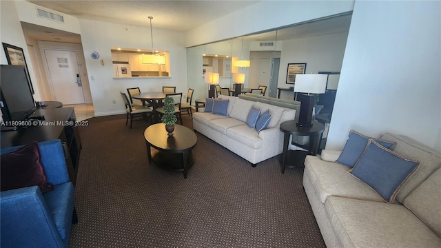 17375 Collins Ave Unit 2606, Sunny Isles Beach, FL 33160 - living area with carpet and baseboards