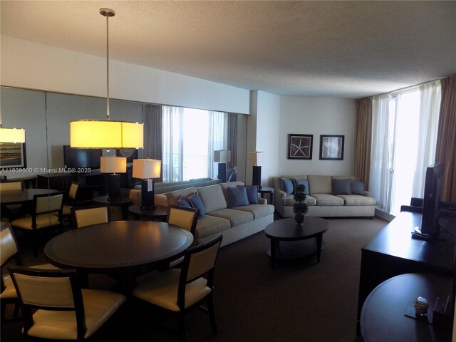 17375 Collins Ave Unit 2606, Sunny Isles Beach, FL 33160 - living area featuring a textured ceiling