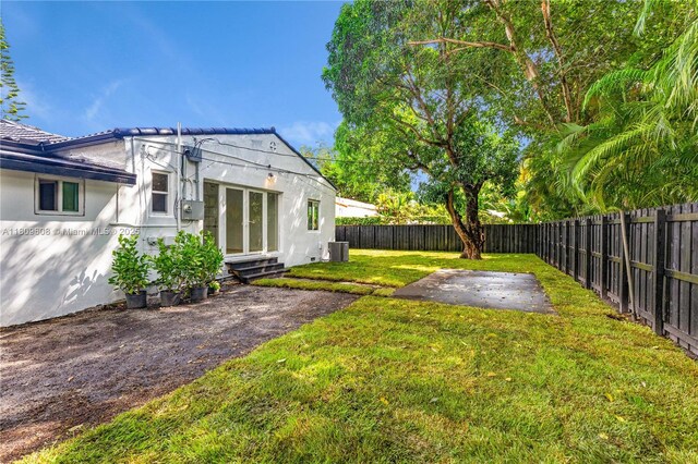 152 NW 103rd St, Miami Shores, FL 33150 - view of yard featuring a patio area and central air condition unit