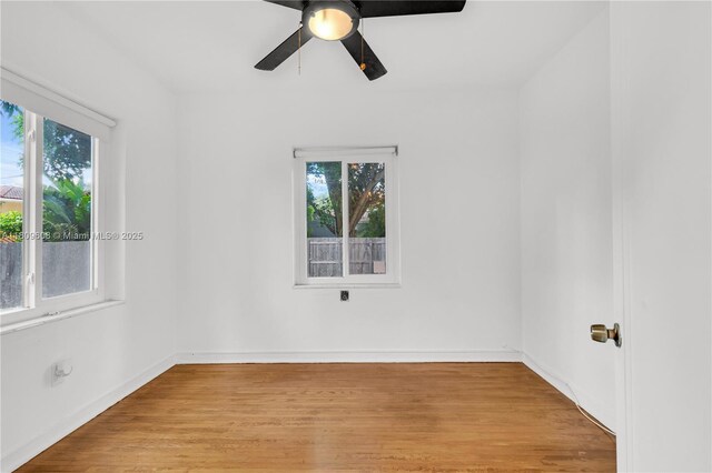 152 NW 103rd St, Miami Shores, FL 33150 - empty room with ceiling fan, light wood-style flooring, and baseboards