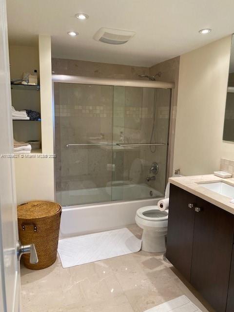 251 174th St Unit 1112, Sunny Isles Beach, FL 33160 - full bathroom featuring vanity, toilet, combined bath / shower with glass door, and recessed lighting