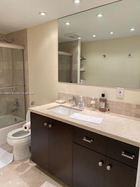 251 174th St Unit 1112, Sunny Isles Beach, FL 33160 - full bath featuring vanity, toilet, backsplash, recessed lighting, and bath / shower combo with glass door