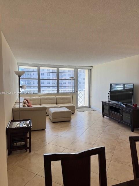 251 174th St Unit 1112, Sunny Isles Beach, FL 33160 - living room with light tile patterned floors and a textured ceiling