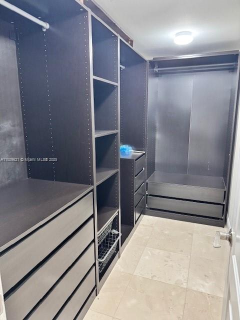 251 174th St Unit 1112, Sunny Isles Beach, FL 33160 - walk in closet featuring tile patterned floors