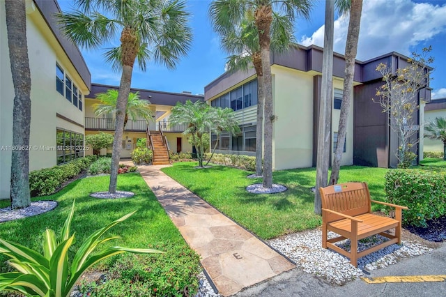 203 E Capri Unit E, Delray Beach, FL 33484 - view of home's community with a lawn and stairway