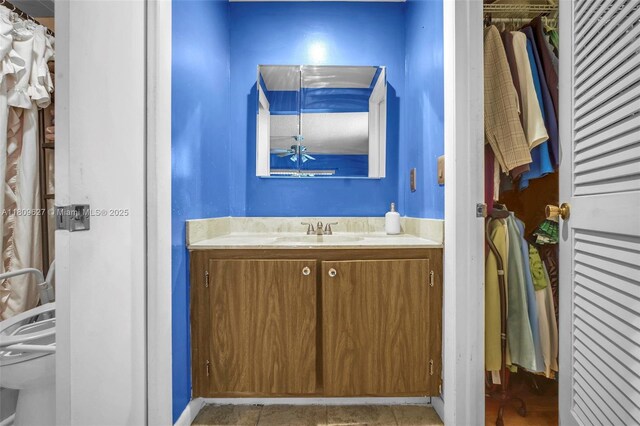 203 E Capri Unit E, Delray Beach, FL 33484 - bathroom with toilet, vanity, and a closet