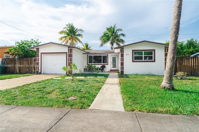 45 NW 188th St, Miami Gardens, FL 33169 - single story home with stucco siding, driveway, and an attached garage