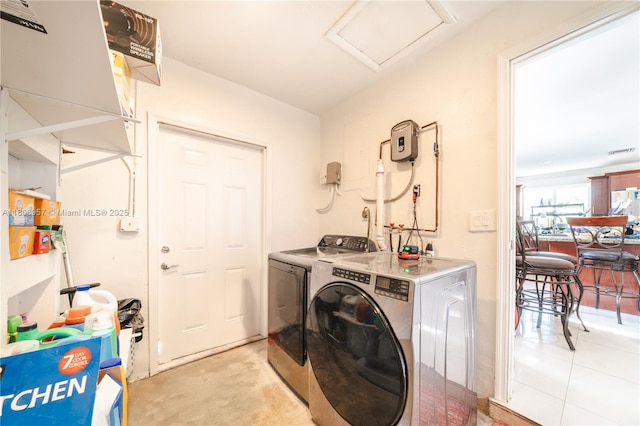 45 NW 188th St, Miami Gardens, FL 33169 - laundry room with washer and dryer and attic access