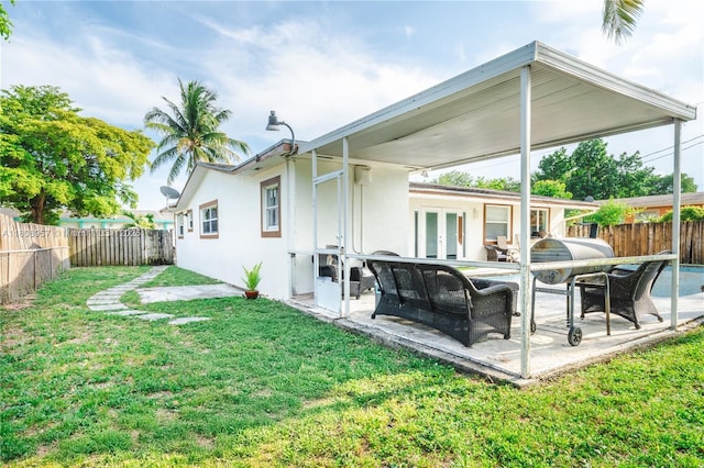 45 NW 188th St, Miami Gardens, FL 33169 - rear view of house featuring french doors, a patio, and stucco siding
