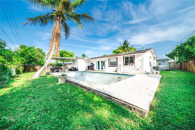45 NW 188th St, Miami Gardens, FL 33169 - back of property featuring french doors and a patio area