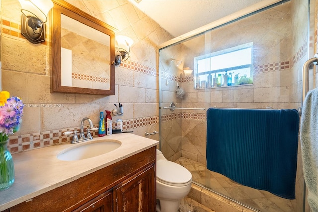 45 NW 188th St, Miami Gardens, FL 33169 - full bath with vanity, a stall shower, toilet, tile walls, and decorative backsplash